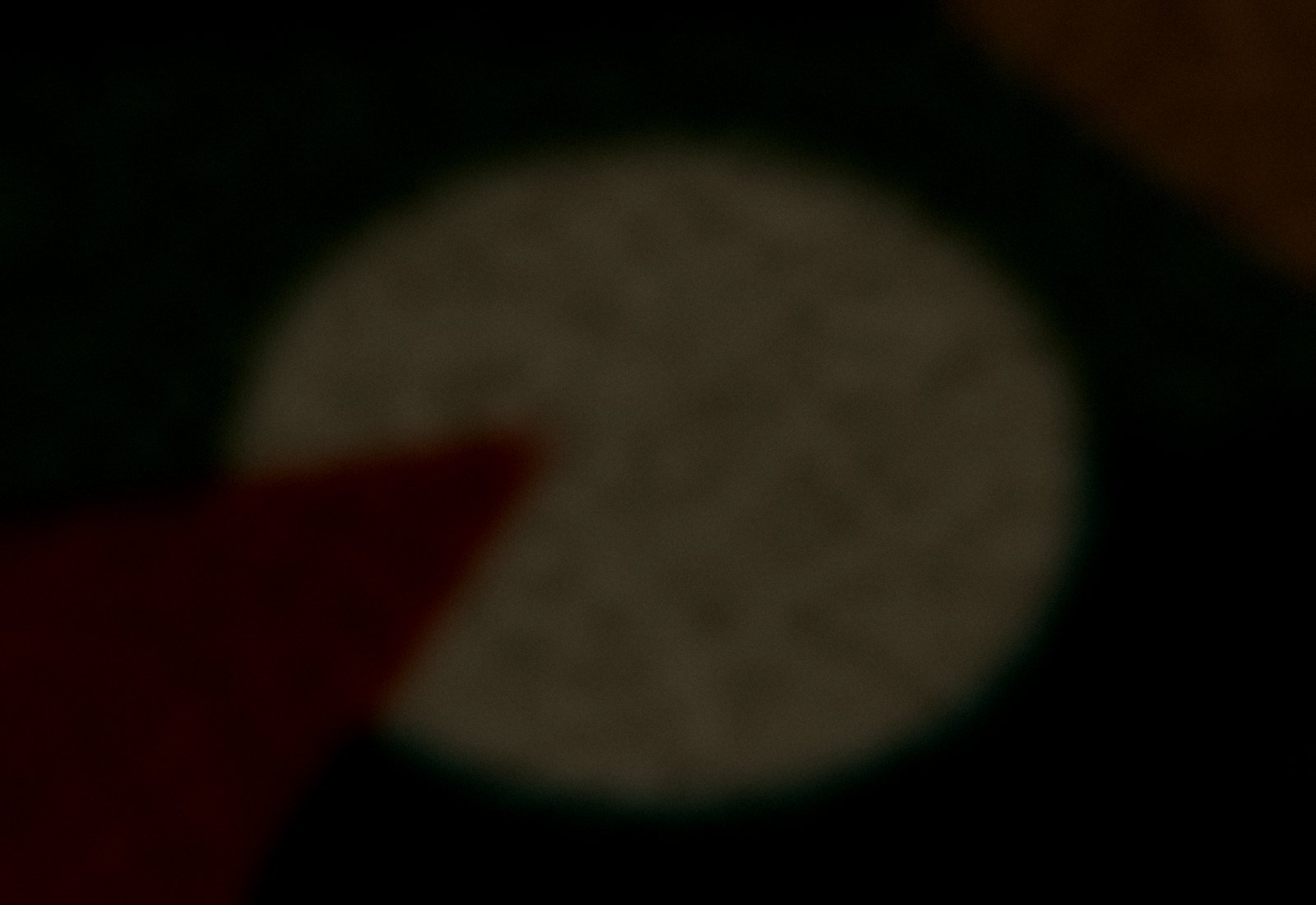 Abstract mineral field with a pale centre and clay edge.